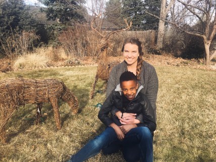 kelly and aj sitting in the grass