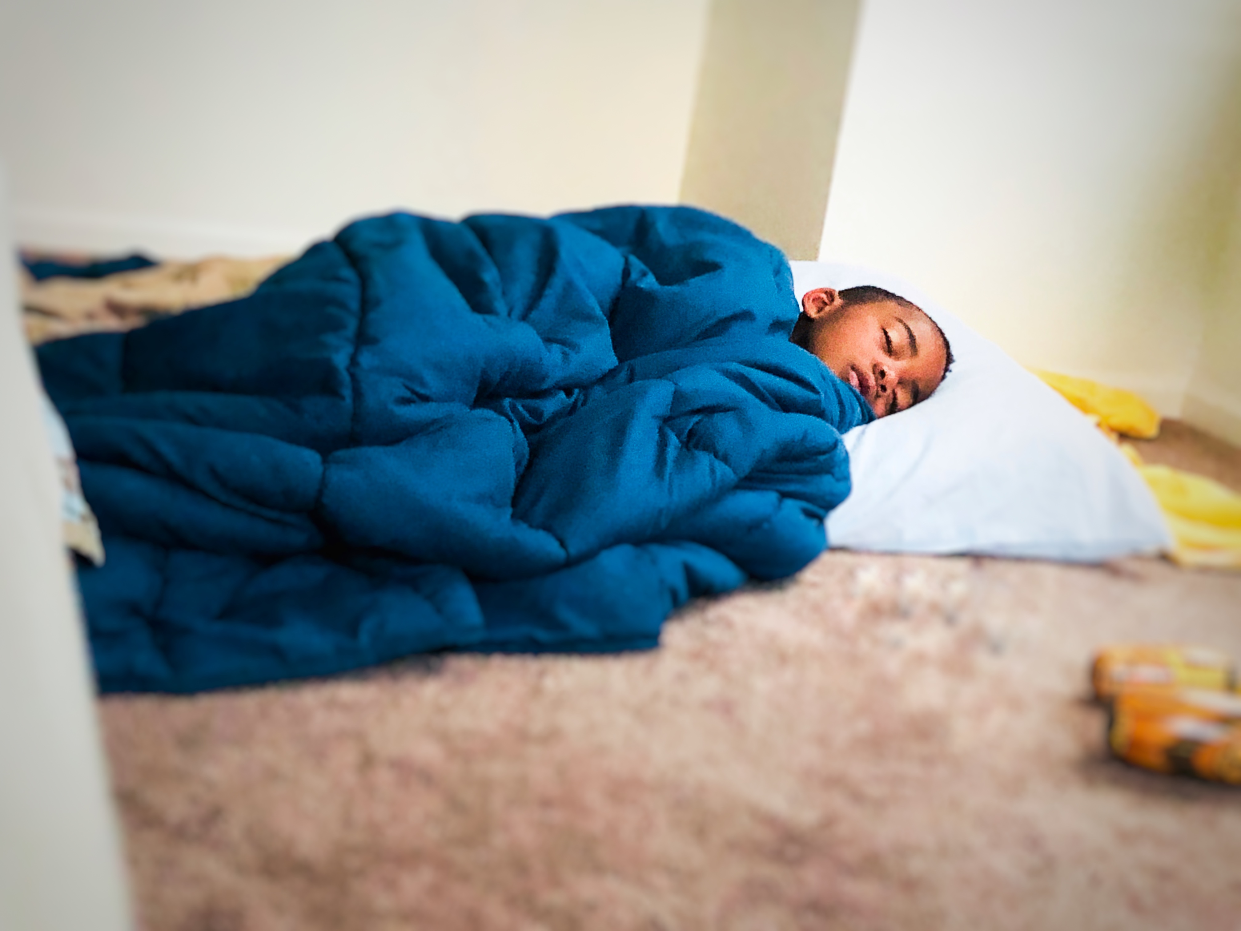 AJ asleep on mat in master bedroom